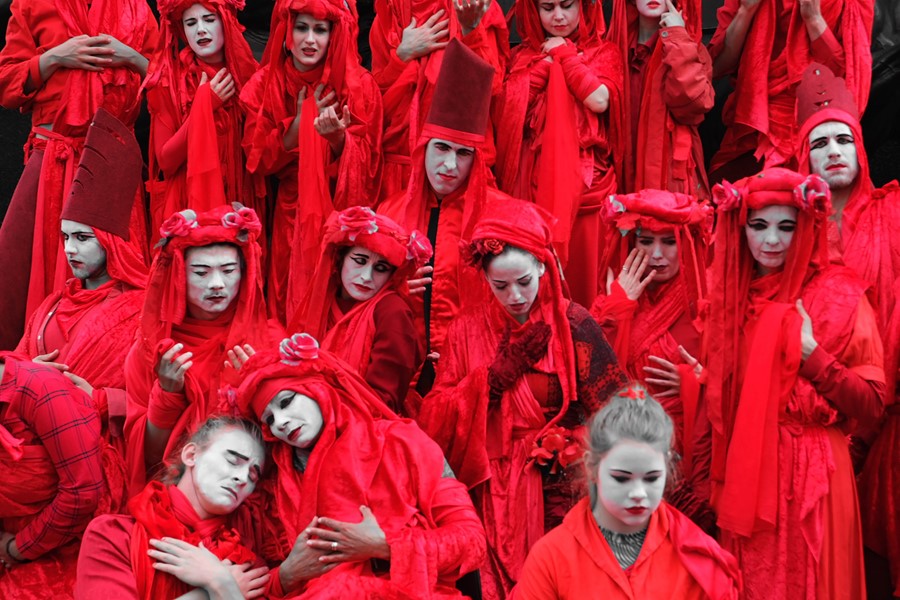 Extinction Rebellion red robed protesters