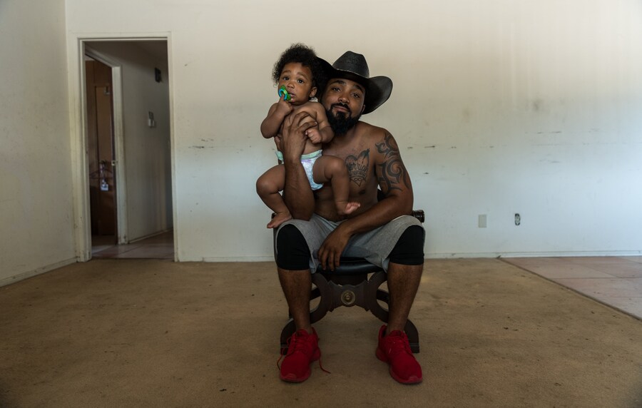 Randy poses with his son 33