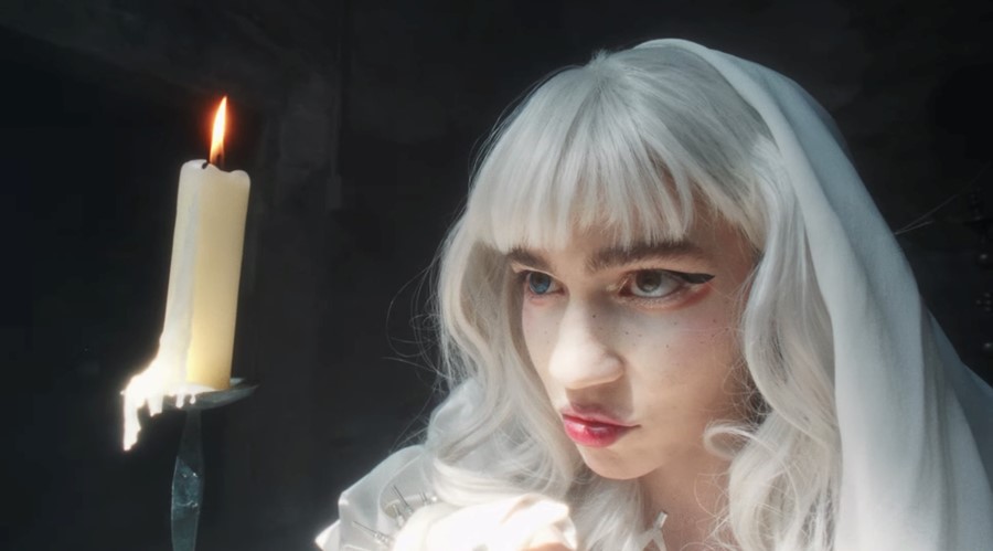 White winged dress worn by Grimes in her Player Of Games Official Music  Video