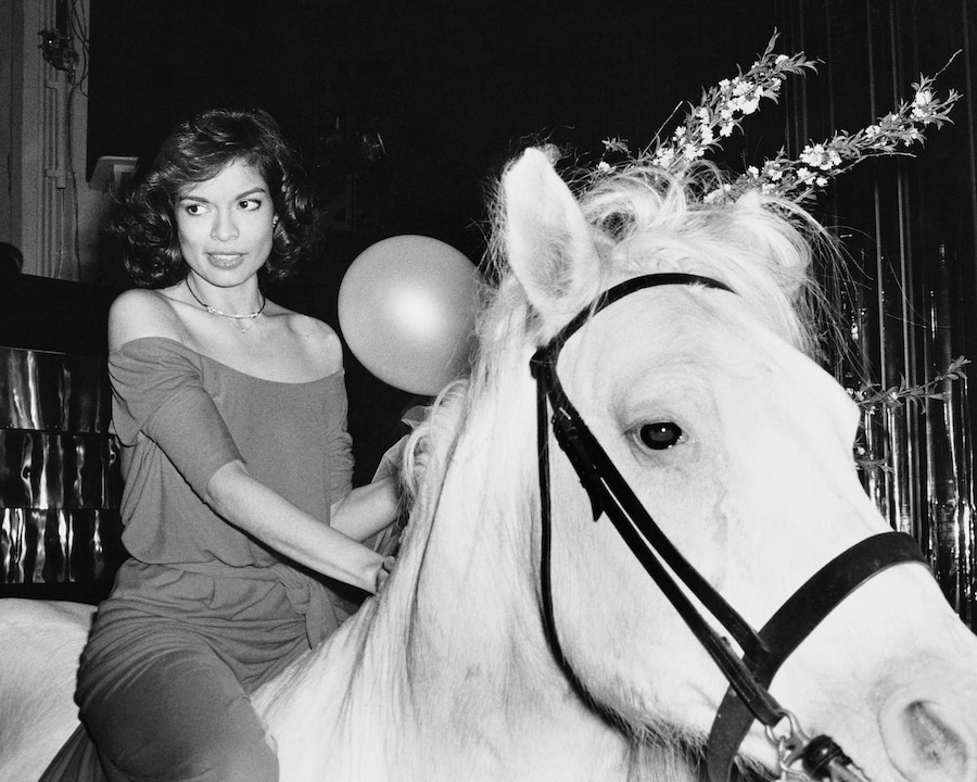 Bianca Jagger rides in on a white horse at during her birthd 2