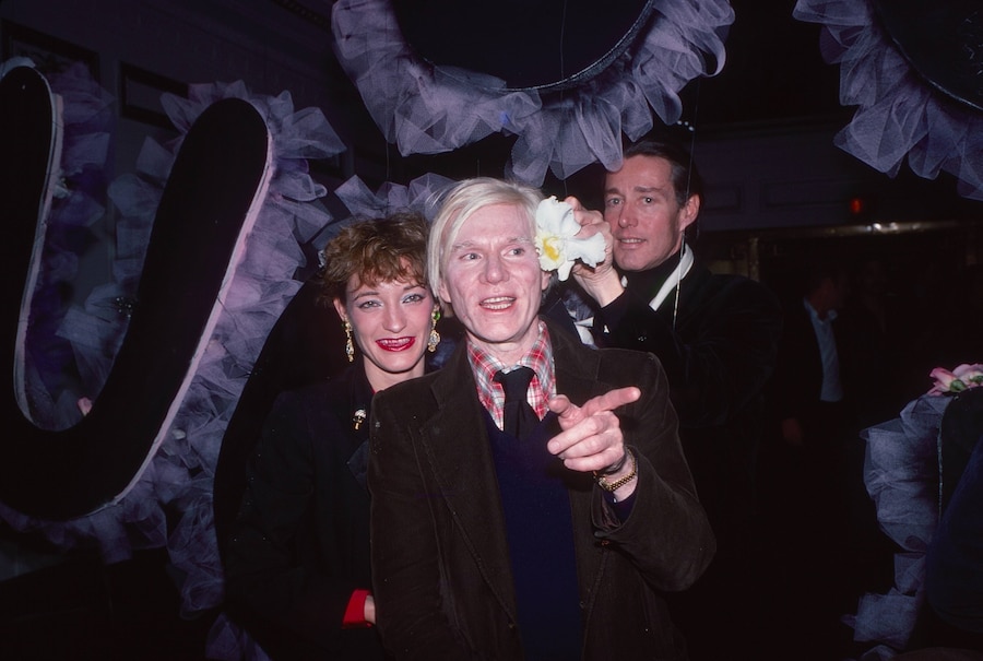 Loulou de la Falaise, Andy Warhol and Halston as they attend 3